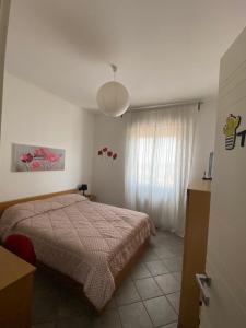 A bed or beds in a room at Le stanze di Mina Még 7 kép