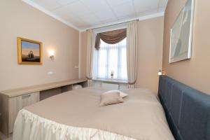 Ein Bett oder Betten in einem Zimmer der Unterkunft Apartments and Rooms kod Eli