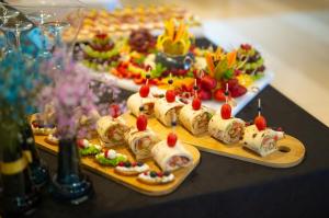 two plates of food on a table with plates of food at Hotel Bor in Krk