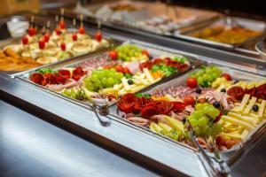 a buffet line with many different types of food at Hotel Bor in Krk