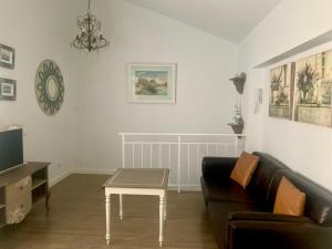 a living room with a couch and a coffee table at Precioso apartamento castro Urdiales in Castro-Urdiales