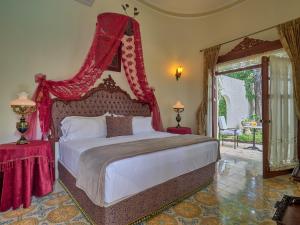 Una cama o camas en una habitación de El Palacito Secreto Luxury Boutique Hotel & Spa