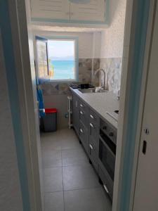 Kuchyň nebo kuchyňský kout v ubytování Cabo Negro Appart M&M + 4 fotografie