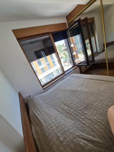 A bed or beds in a room at Avram