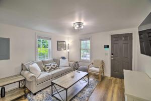 a living room with a couch and a table at Updated Bristol Retreat about 2 Miles to Downtown! in Bristol