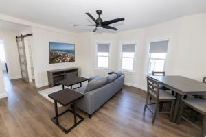 a living room with a couch and a table at Seaside Sands Inn in Seaside Heights