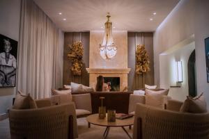 a living room with a couch and a fireplace at Susana Balbo Winemaker´s House in Ciudad Lujan de Cuyo