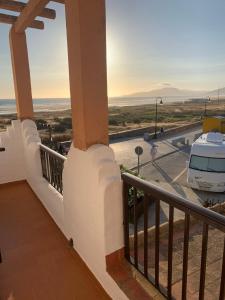 a balcony of a house with a view of the ocean at Apartamento a pie de playa in Tarifa