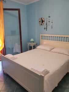 Giường trong phòng chung tại Villetta Dana