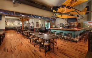 a large kitchen with wooden floors and wooden tables at Great Wolf Lodge Sandusky in Sandusky