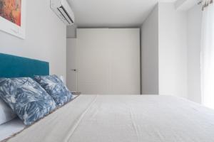 Posteľ alebo postele v izbe v ubytovaní Reinapart Valencia Beach
