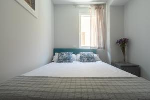 Posteľ alebo postele v izbe v ubytovaní Reinapart Valencia Beach