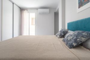 Posteľ alebo postele v izbe v ubytovaní Reinapart Valencia Beach