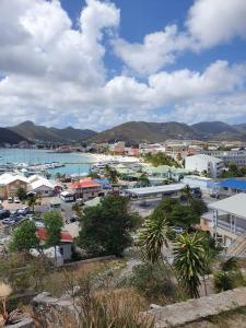 a city with a harbor and a town with buildings at The Aquila Villa in Philipsburg