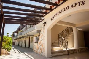 a building with stairs on the side of it at Crystallo Apartments in Paphos