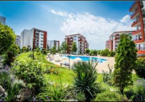 an image of an apartment complex with a swimming pool at 2-комнатные апартаменты у моря 10 бассейнов Crown Fort Noks in Sveti Vlas