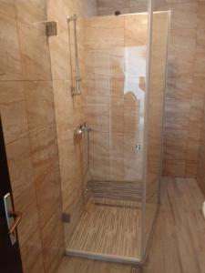 a shower with a glass door in a bathroom at Holiday home Buljat in Kaštela +22 photos