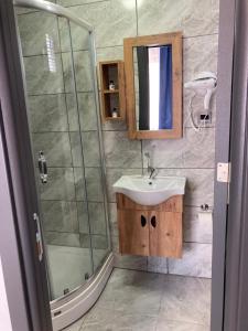 a bathroom with a sink and a shower at BossPort Hotel in Tekirdag