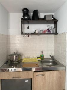 Kuchyňa alebo kuchynka v ubytovaní DIONI