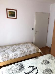 Postel nebo postele na pokoji v ubytování Vito & Rocco Apartment