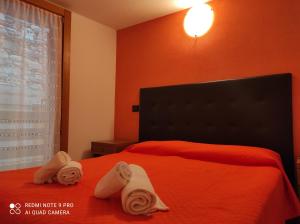 Postel nebo postele na pokoji v ubytování Orobie Holiday Apartments