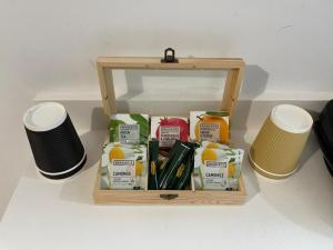 a wooden box filled with food and two stools at Jz Plus e'Bella in Rhodes Town