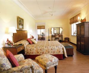 Voodi või voodid majutusasutuse The LaLit Grand Palace Srinagar toas