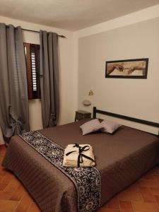 En eller flere senge i et værelse på Appartamento Martina2