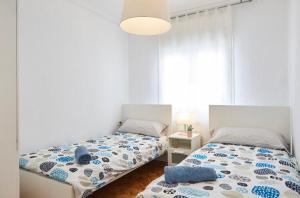 Rúm í herbergi á Apartamento Pamplona