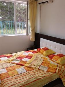 A bed or beds in a room at Caprice Apartment in Lozenec