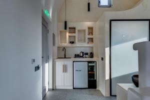 Eldhús eða eldhúskrókur á Elements Cozy Suites Pyrgos