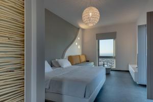 Rúm í herbergi á Elements Cozy Suites Pyrgos