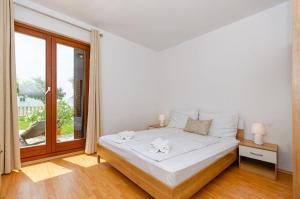 Posteľ alebo postele v izbe v ubytovaní Apartments Mrs Brightside