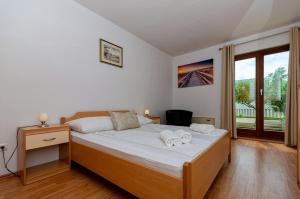 Posteľ alebo postele v izbe v ubytovaní Apartments Mrs Brightside