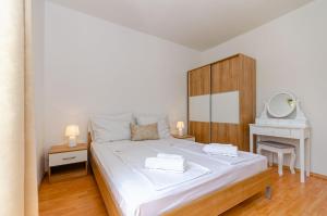 Posteľ alebo postele v izbe v ubytovaní Apartments Mrs Brightside