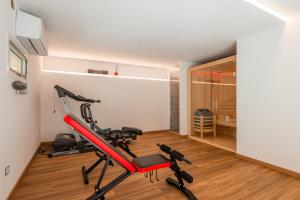 a gym with a treadmill in a room at Il Genovino Caffa in Genova