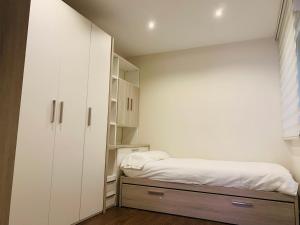 A bed or beds in a room at A Misericordia Viveiro