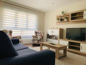 A television and/or entertainment centre at A Misericordia Viveiro