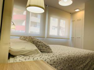 A bed or beds in a room at A Misericordia Viveiro