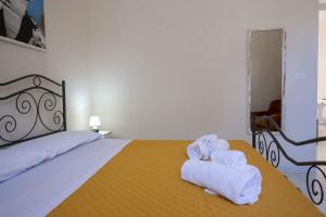 Postel nebo postele na pokoji v ubytování Le cale di Favignana Cala Rossa