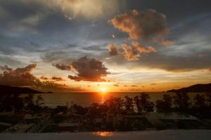 a view of a sunset from the balcony of a resort at PATONGTOWER 3 BEDROOMs 2026 in Patong Beach +32 photos