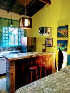 Virtuvė arba virtuvėlė apgyvendinimo įstaigoje Chalés Ilhabela