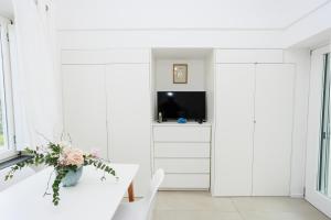 TV a/nebo společenská místnost v ubytování La Pigna Blu