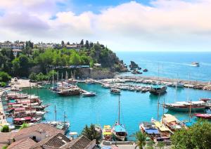 a bunch of boats are docked in a harbor at Antalya belek Mermaid villas 3 bedrooms close the beach park 2 in Belek