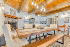 a dining room with a table and chairs and a fireplace at Happy Hours in Government Camp