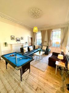 a living room with a pool table in it at Newington House in Edinburgh