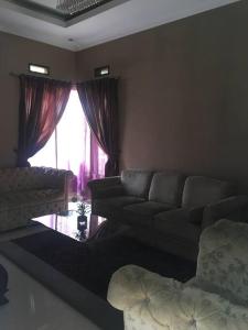 Area tempat duduk di Nice house with modern furniture at Bandung