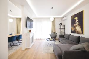 a living room with a couch and a table at Olive Residence in Zadar