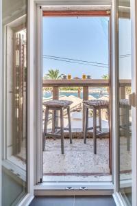 a view of a balcony with a table and chairs at Apartment Vin - sea promenade in Supetar