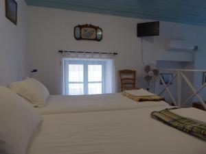 Postel nebo postele na pokoji v ubytování Halki Townhouse